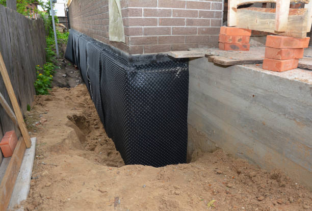SJ Waterproofing Pros technician performing targeted Exterior Waterproofing assessment in Fall River, WI